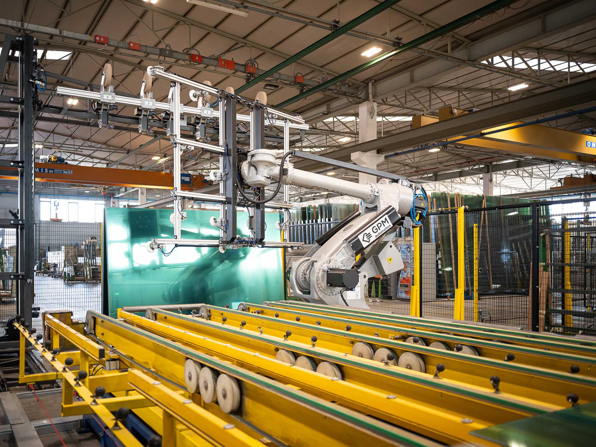 Impianto automatizzato per la molatura del vetro